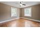 Bedroom showcasing hardwood floors and natural light from two windows at 627 N Flint St, Lincolnton, NC 28092