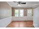 Sunny dining area with hardwood floors, a ceiling fan, and an exit door at 627 N Flint St, Lincolnton, NC 28092