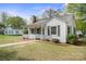 Classic single-story home with a quaint front porch, dark shutters, and a tidy landscaped yard at 627 N Flint St, Lincolnton, NC 28092