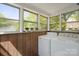 Laundry room with a washer and dryer near paneled windows at 627 N Flint St, Lincolnton, NC 28092
