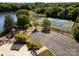 Overhead shot of community pool, park, and tennis courts surrounded by lush trees at 6904 Mordred Ln, Charlotte, NC 28277
