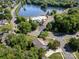 An inviting aerial view of the community, showcasing a serene lake, a community pool, and beautiful landscaping at 6904 Mordred Ln, Charlotte, NC 28277