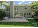 Exterior home view shows a patio, backyard, and multiple windows at 6904 Mordred Ln, Charlotte, NC 28277