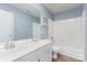 Well-lit bathroom featuring a double sink vanity and a shower-tub combination at 6904 Mordred Ln, Charlotte, NC 28277