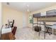 This bedroom has an open feel with light walls, carpet and study space at 6904 Mordred Ln, Charlotte, NC 28277