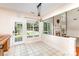 Dining area with large windows overlooking the backyard and open to the living room at 6904 Mordred Ln, Charlotte, NC 28277