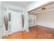 Bright foyer featuring white trim, hardwood floors and stylish decor, creating an inviting entrance at 6904 Mordred Ln, Charlotte, NC 28277
