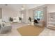 Bright home office boasts a modern desk, comfortable seating, and ample natural light at 6904 Mordred Ln, Charlotte, NC 28277