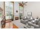 Bright living room featuring a fireplace, soaring windows, and neutral decor at 6904 Mordred Ln, Charlotte, NC 28277