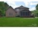 Brick home with a spacious backyard and screened-in porch, perfect for entertaining at 6927 Ellington Farm Ln, Mint Hill, NC 28227