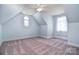 Unique bedroom with dormer windows and soft carpeting, blending charm with comfort at 6927 Ellington Farm Ln, Mint Hill, NC 28227