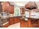 Beautiful kitchen featuring stainless steel appliances, granite countertops, and custom cabinetry at 6927 Ellington Farm Ln, Mint Hill, NC 28227