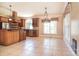 Bright kitchen with tile flooring, wooden cabinets, stainless steel appliances, and a breakfast area at 6927 Ellington Farm Ln, Mint Hill, NC 28227