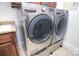 Modern laundry room featuring a front loading washer and dryer set at 6927 Ellington Farm Ln, Mint Hill, NC 28227