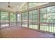 Inviting screened porch featuring a vaulted ceiling, wood-look flooring, and outdoor views at 6927 Ellington Farm Ln, Mint Hill, NC 28227