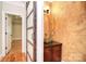 Charming powder room with decorative walls, granite countertops, and a vessel sink at 6927 Ellington Farm Ln, Mint Hill, NC 28227