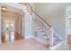 Staircase featuring carpeted steps and access to multiple rooms in the home at 6927 Ellington Farm Ln, Mint Hill, NC 28227
