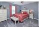 Bedroom with a bench seat, large window, and a traditional-style ceiling fan at 7397 Mill Ruins Sw Ave, Concord, NC 28025