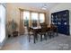 The dining area boasts lots of natural light, colorful wall decor and a classic china cabinet at 7397 Mill Ruins Sw Ave, Concord, NC 28025