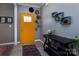 The foyer showcases a stylish colorful rug, yellow door, and unique decorative touches at 7397 Mill Ruins Sw Ave, Concord, NC 28025