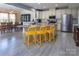 Bright, open kitchen featuring stainless steel appliances, granite countertops, and a large island with bar seating at 7397 Mill Ruins Sw Ave, Concord, NC 28025