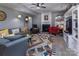 The cozy living room features a fireplace, colorful accents, and comfortable seating, perfect for relaxing at 7397 Mill Ruins Sw Ave, Concord, NC 28025