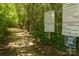 City of Concord Parks & Recreation trail entrance with signs and information at 7397 Mill Ruins Sw Ave, Concord, NC 28025