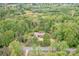 Aerial view of a home nestled among lush green trees and foliage at 78 N Scalybark Trl, Concord, NC 28027