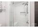 Beautiful, tiled shower features seamless glass enclosure and integrated seating at 78 N Scalybark Trl, Concord, NC 28027