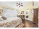 Comfortable bedroom featuring a queen-sized bed, natural light, and an attached bathroom at 78 N Scalybark Trl, Concord, NC 28027