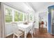Bright dining room features hardwood floors, large windows with natural light, and elegant decor at 78 N Scalybark Trl, Concord, NC 28027
