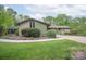A charming house with stone and siding, complemented by a lush green lawn at 78 N Scalybark Trl, Concord, NC 28027