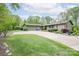 Beautifully landscaped home with a stone facade and a well-manicured lawn at 78 N Scalybark Trl, Concord, NC 28027