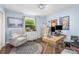 Bright home office featuring a modern desk, comfortable seating, and decoratively adorned walls and window at 78 N Scalybark Trl, Concord, NC 28027