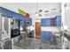 Bright, blue kitchen with stainless steel appliances, granite countertops, and custom cabinetry at 78 N Scalybark Trl, Concord, NC 28027