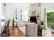 Inviting living room with a stone fireplace, hardwood floors, and large windows for natural light at 78 N Scalybark Trl, Concord, NC 28027
