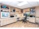 Home office featuring built-in cabinets, desk space, and hardwood floors at 78 N Scalybark Trl, Concord, NC 28027