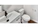 Clean bathroom featuring a new toilet and a vanity with a modern black faucet at 805 Gunnar Dr, Gastonia, NC 28054