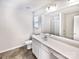 Modern bathroom features white vanity, large mirror, tile floors and a shower at 805 Gunnar Dr, Gastonia, NC 28054