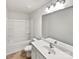 Bright bathroom featuring a shower-tub combo and a vanity with a sink and large mirror at 805 Gunnar Dr, Gastonia, NC 28054