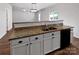 Modern kitchen with stainless steel dishwasher, granite counters, and white cabinets at 805 Gunnar Dr, Gastonia, NC 28054