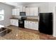 Functional kitchen equipped with white cabinets, modern appliances, and granite countertops at 805 Gunnar Dr, Gastonia, NC 28054