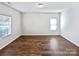Spacious living room with hardwood floors and great natural light from the windows at 805 Gunnar Dr, Gastonia, NC 28054