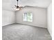 Large main bedroom featuring carpet floors and a ceiling fan at 805 Gunnar Dr, Gastonia, NC 28054