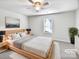Comfortable main bedroom featuring a large bed, soft carpet, and neutral tones at 805 Gunnar Dr, Gastonia, NC 28054