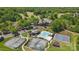 Aerial view of the community clubhouse, pool, tennis courts, basketball courts, and surrounding green space at 902 Hoke Trl, Cramerton, NC 28032