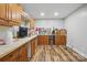 Spacious unfinished basement with wood cabinets and laminate floors at 902 Hoke Trl, Cramerton, NC 28032