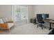 Bright bedroom features a large window and home office setup with chair at 902 Hoke Trl, Cramerton, NC 28032