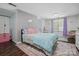 Bedroom with a large rug and a window with purple curtains at 902 Hoke Trl, Cramerton, NC 28032