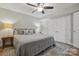 Bedroom with ceiling fan, laminate floors, and spacious closets at 902 Hoke Trl, Cramerton, NC 28032